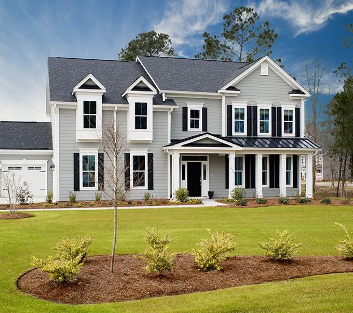 New construction two-story home with large lawn