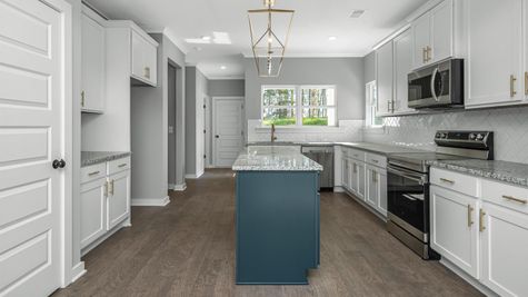 Island, pantry, tons of countertops, lots of cabinets in soft-close design