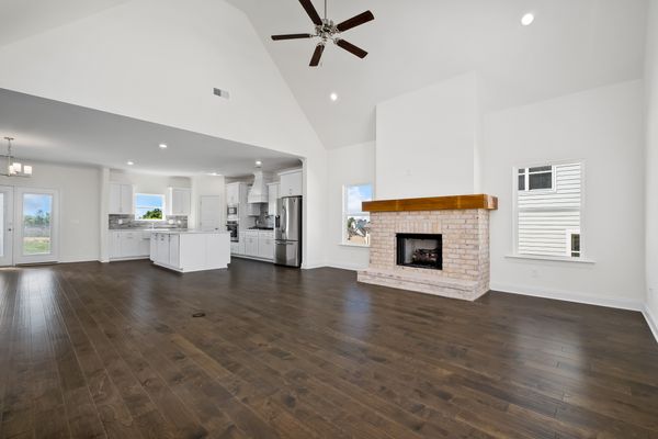 Interior photo of living room and kitchen with open concept floorplan