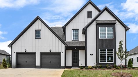 Exterior photo of 2 story home with white siding, dark accents, and a peppercorn front door