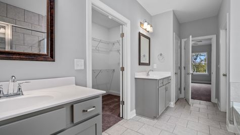 Interior of bathroom with gray cabinets