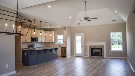 Interior view of an open concept floorplan with fireplace