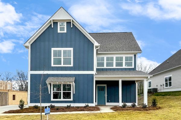 Exterior Photo of 2 story home with blue siding and blue front door built by newcastle homes in camellia ridge