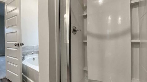 interior photo of master bathroom with separate tub & shower