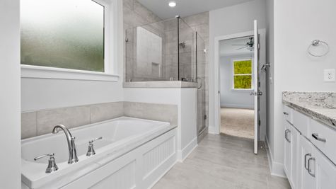 Interior photo of a bathroom with soaking tub and separate shower