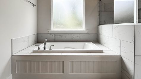 Interior photo of marble tiled tub