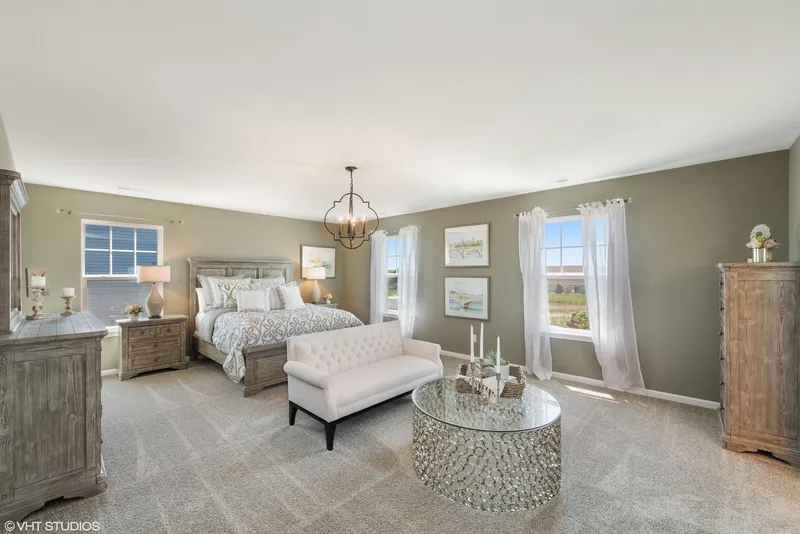 master bedroom in a new home in palmira lakes by home builder olthof homes