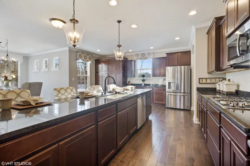 spacious kitchen island in dunewood trails community by olthof homes