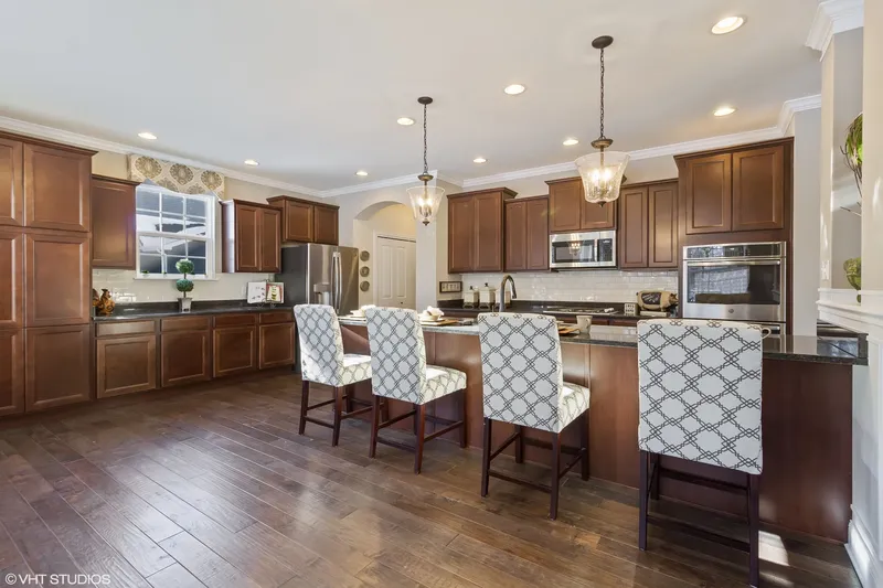 spacious kitchen in a new home in rolling oaks community built by olthof homes