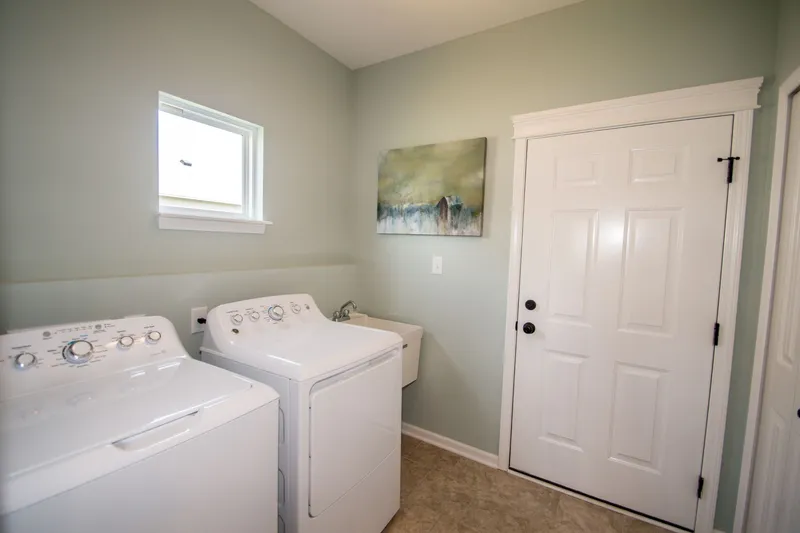 laundry room in a new home in emerald crossing by olthof homes