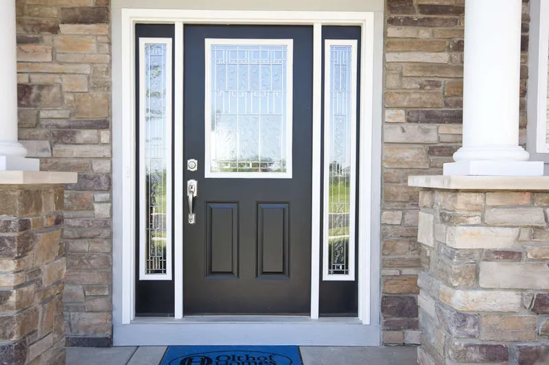 front door of a new home in belmont woods community by olthof homes
