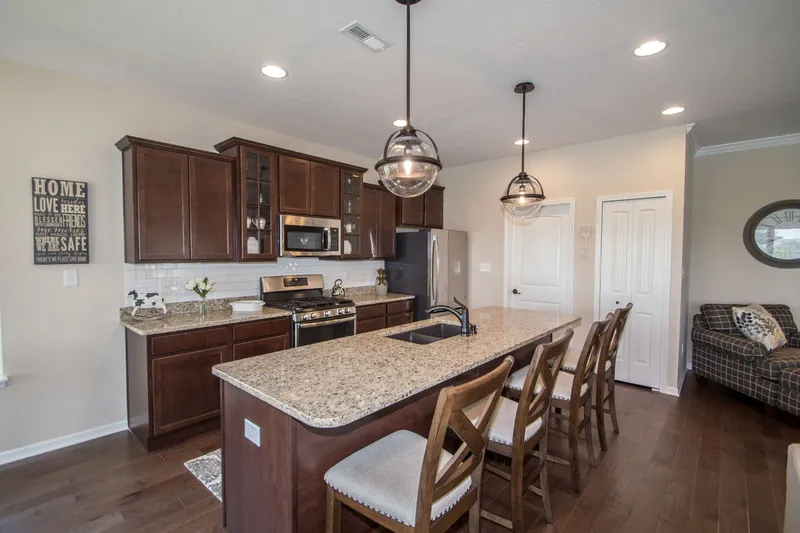kitchen in palmira lakes community by olthof homes