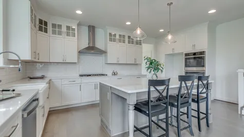 A stunning white kitchen with large center island
