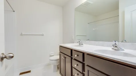 Augusta upstairs bathroom with double sink and shower