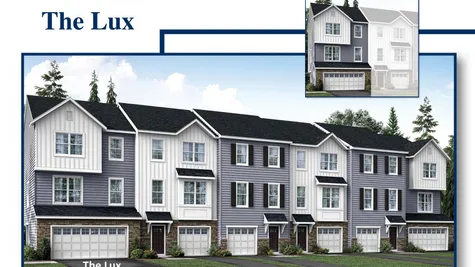 Large New Townhome in South Jersey with two car garage, end unit, stone accents, gray siding, plus white siding.