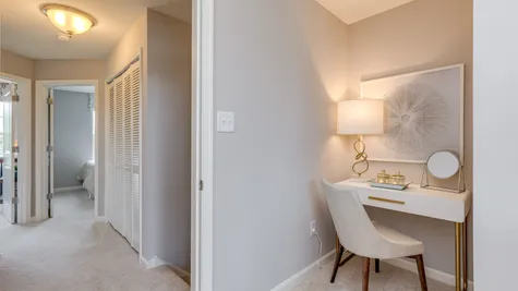 A nook within the owner's bedroom shown as the perfect spot to put a makeup table with lamp.