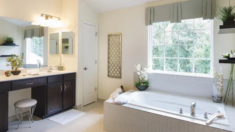 Baldwin master bathroom with soaking sub, large window, double sink vanity.