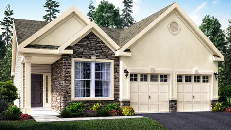 The Jasmine Villa model home illustrated with cream stucco, stone facade around front window, muti-peak roof line, one story home, 2 garages.