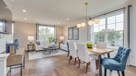 An open concept living room and dining room area on the 2nd floor of our new construction townhomes.