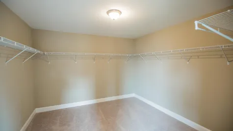 Oakton model new home in NJ, very large Walk-in closet in master bedroom with wire racks.