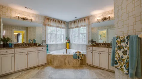 Very large master bathroom in Brandywine with two different vanities and sinks plus soaking tub