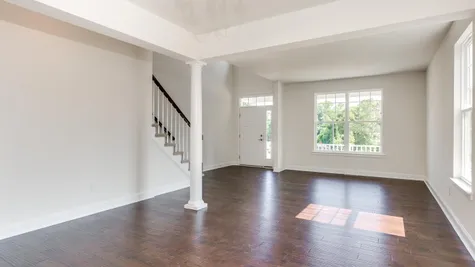 Living room of the Ashton model home in South Jersey, white, wood floor, no furniture.