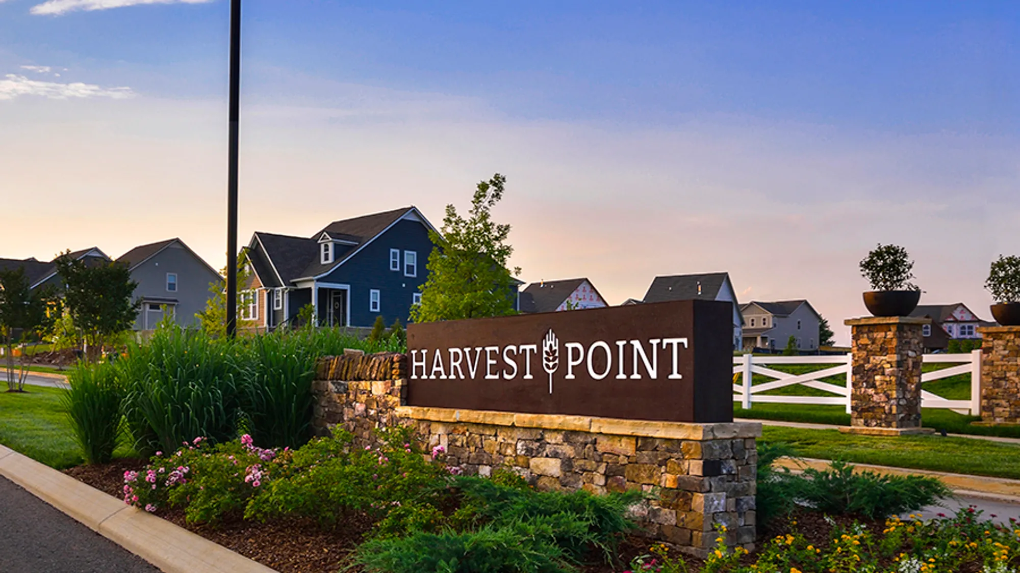 Harvest Point Entrance Monument at sunset