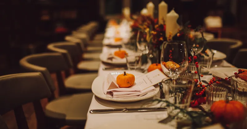 Image of a dining table set with a fall theme.