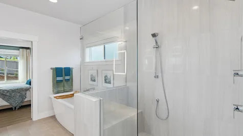 shower with bench seat and two showerheads