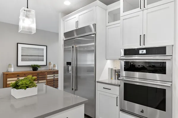 close up view of kitchen with 48" refrigerator/freezer and double wall oven/convection micro