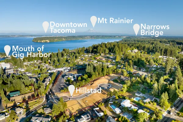 aerial view from above hillstad new home community with area attractions called out including downtown tacoma, mount rainier and the narrows bridge