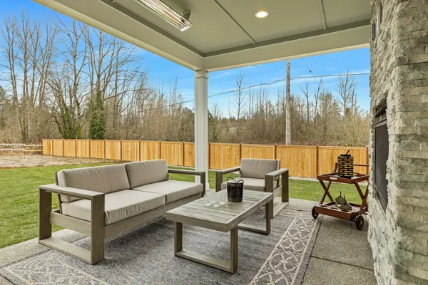 covered outdoor living with furnishings and heater