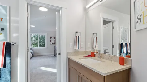 bathroom between two bedrooms with two separate vanities