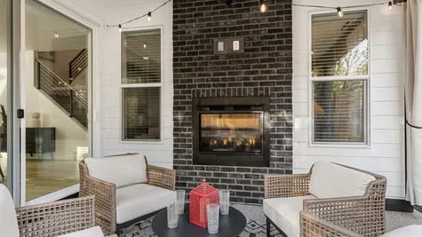 outdoor patio with indoor/outdoor fireplace