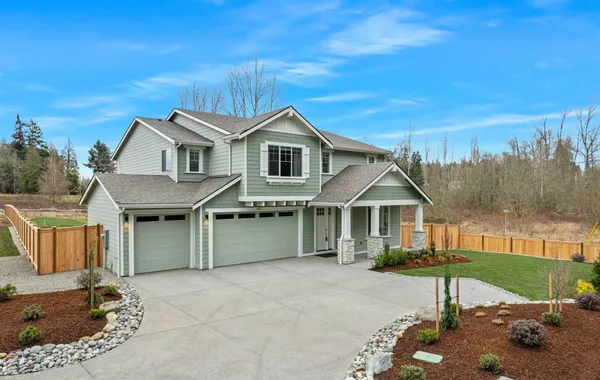 new home with 3-car garage on large lot