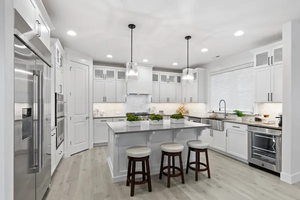 big kitchen with stainless appliances and big central kitchen island
