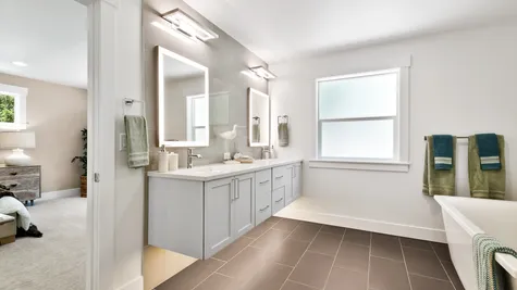 Spa-like primary bath with heated tile floors