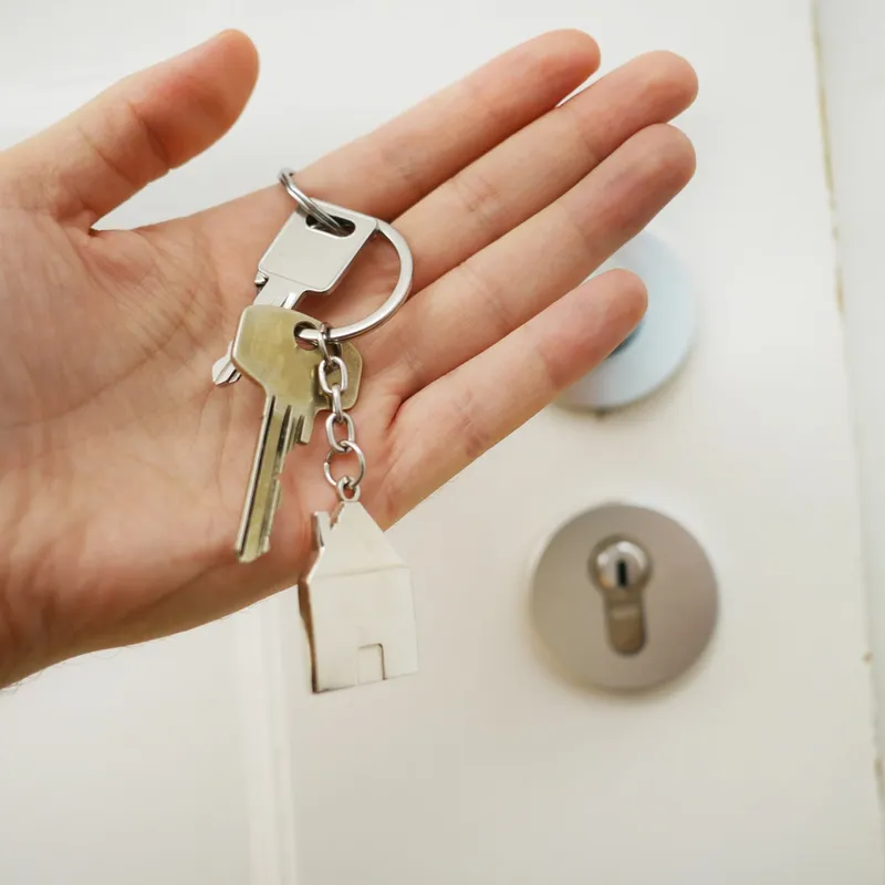 Keys to a home in a person's hand