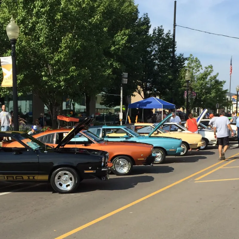 Several classic cars lined up for the Woodward Dream Cruise in Detroit, Michigan