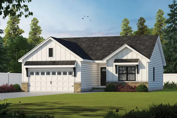 Front exterior of The Cumberland by Rockwood Homes, a single-story white board and batten home with a two-car garage.