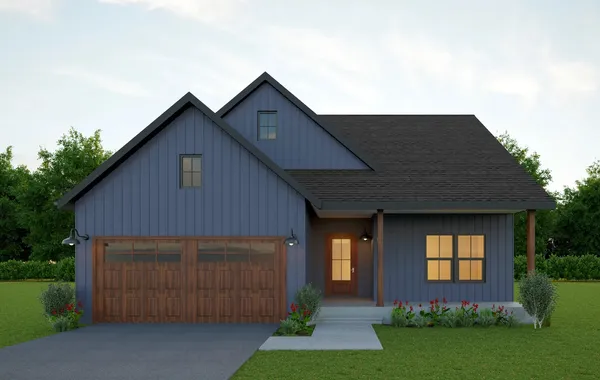 Front exterior of The Hickory by Rockwood Homes, a single-story home with navy board and batten siding and a two-car garage.