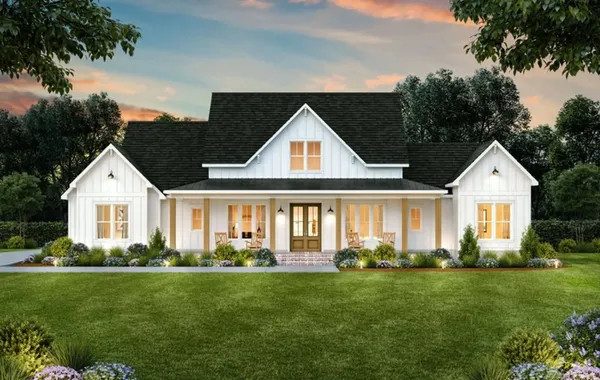 Front exterior of The Wofford by Rockwood Homes, a 1.5-story white farmhouse-style home with a covered front porch.