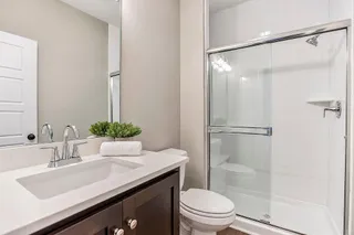 Full Bath on Main Level, accessible to guest and the Main Level Guest Bedroom. PHOTO IS OF ACTUAL HOME.