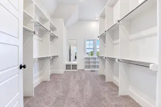 Primary Bath with HIS and HER Vanity, Walk In Shower with 2 Shower Heads and a King Size Walk In Closet. PHOTO IS OF ACTUAL HOME.