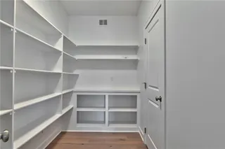 Large walk-in pantry. Picture is of the actual home.