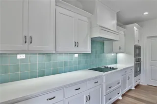 Enameled cabinets in the large kitchen. Picture is of the actual home.
