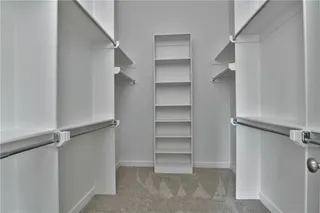Master closet has lots of space. Picture is of the actual home.