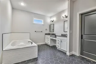 Guest Bathroom on Main Level.  Picture is of Actual Home.