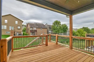 Covered Deck with Stairs.  Picture is of Actual Home.