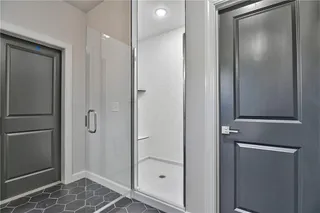 Walk In Master Shower.  Picture is of Actual Home.